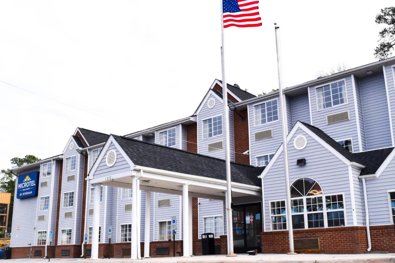 Travelers Inn And Suites ローリー エクステリア 写真